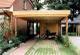 Holzcarport mit Flachdach und Holzblende